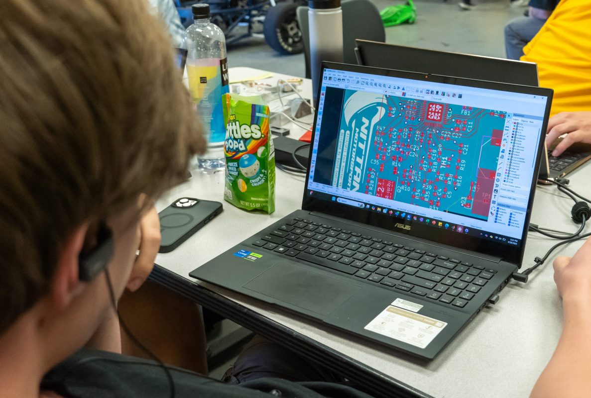 Nittany Motorsports team member reviews and refines the car's battery management system PCB layout. Great care must be taken in the design of such boards to avoid unwanted interference between signals present on the board.